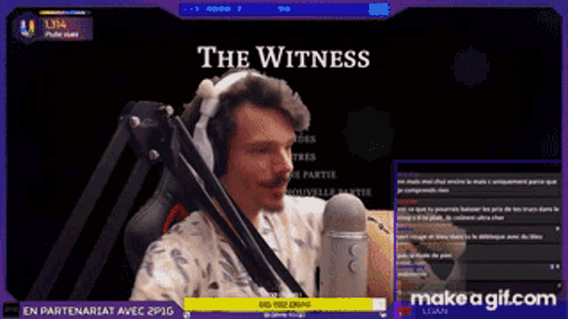 a man wearing headphones is sitting in front of a microphone with the words " the witness " above him