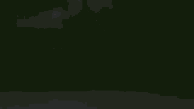 a blurry picture of a person 's hand in the dark .
