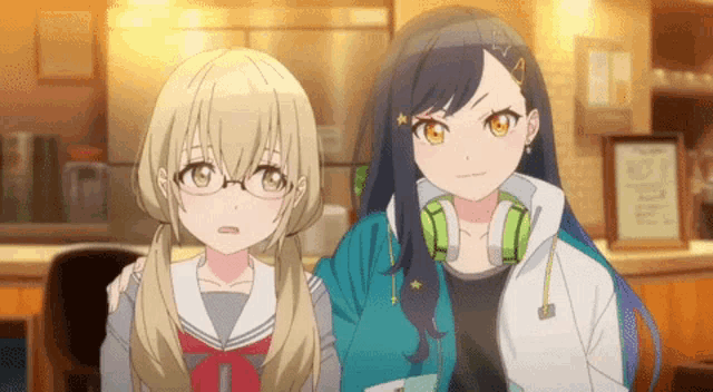two anime girls are standing next to each other