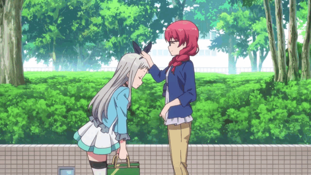 two anime girls are standing next to each other