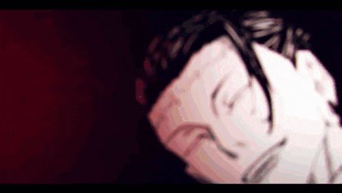 a blurry picture of a man 's face with a dark background