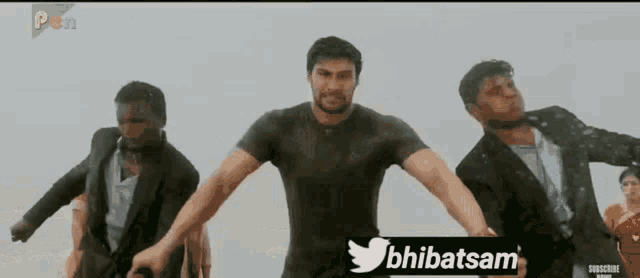 a group of men are dancing in front of a twitter icon
