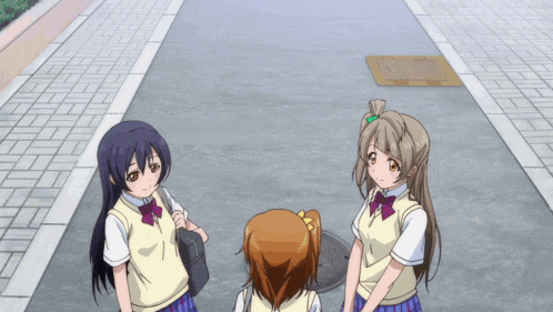 three anime girls are standing on a sidewalk looking up