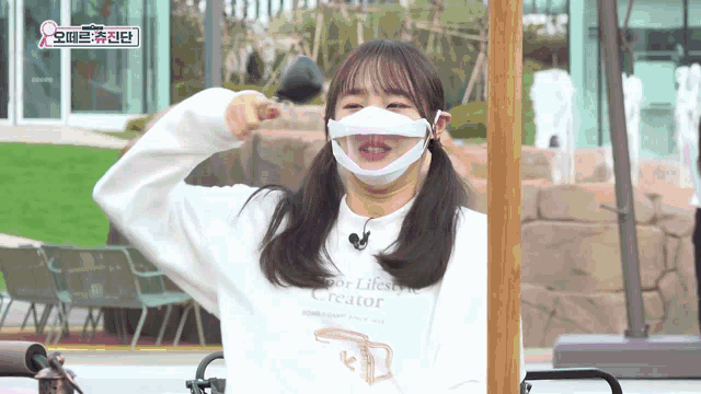 a girl wearing a white shirt that says sport lifestyle creator on it