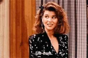 a woman in a black sequined top says uh huh