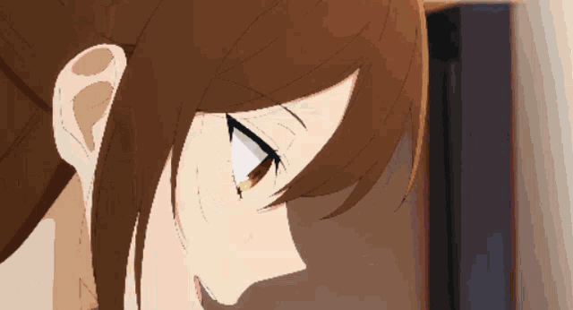 a close up of a person 's face with a shadow on the wall