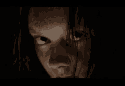 a close up of a girl 's face with a dark background