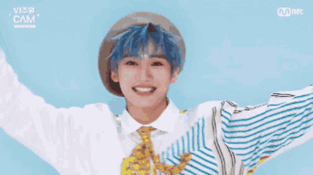 a boy with blue hair is wearing a striped shirt and tie