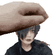 a pixelated image of a hand holding a woman 's head ..
