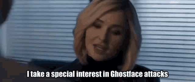 a woman is sitting in front of a window and says i take a special interest in ghostface attacks .