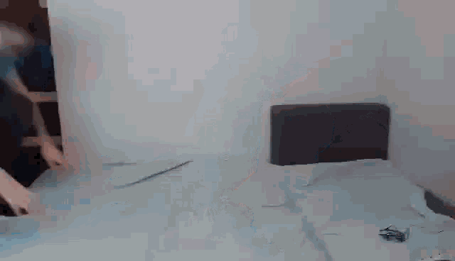 a person is doing a handstand on a bed in a room .