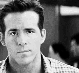 a black and white photo of a man in a plaid shirt .