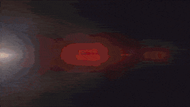 a red and blue light is coming out of a dark background