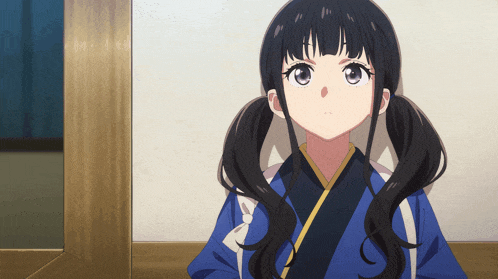 a girl with pigtails is wearing a blue and white kimono