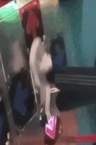 a blurred image of a person standing in front of a sign that says ' a ' on it