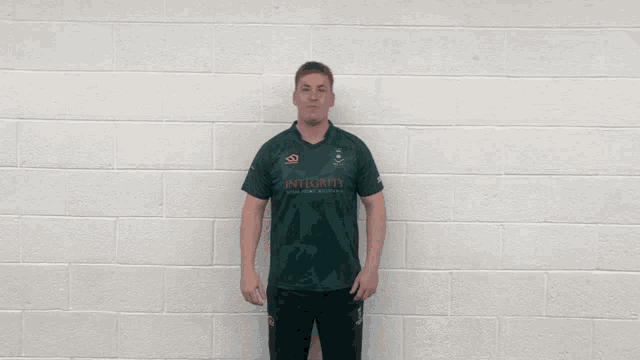 a man wearing a wormwell jersey with the number 15