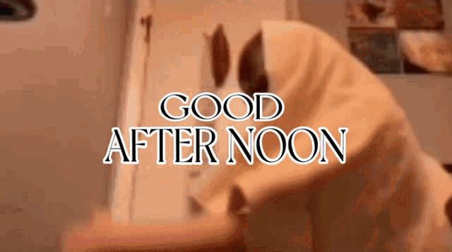 a sign that says good after noon with a person in a robe