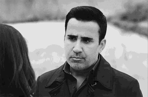 a black and white photo of a man and woman