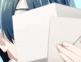 a close up of a person reading a book .