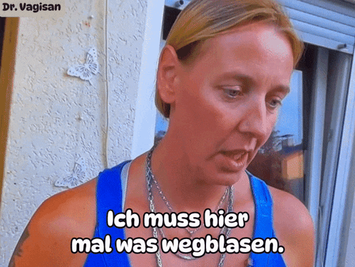 a woman in a blue tank top with the words ich muss hier mal was wegblasen