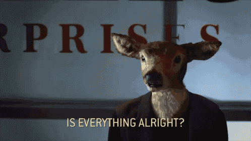 a stuffed deer in front of a sign that says " rprises "
