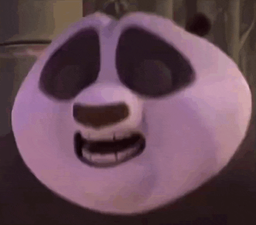 a close up of a panda bear 's face with a purple mask on .