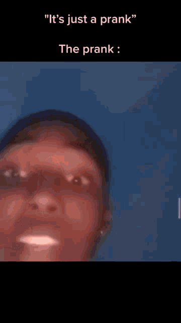 a blurry picture of a person 's face with the words " it 's just a prank "