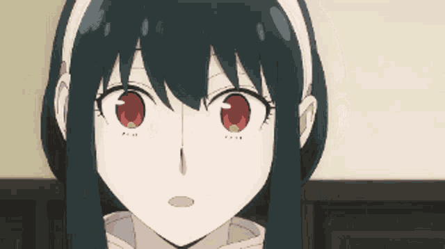 a girl with black hair and red eyes looks at the camera
