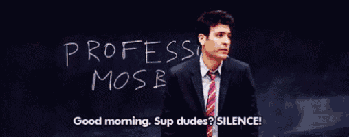 a man in a suit and tie stands in front of a chalkboard that says professor mosb
