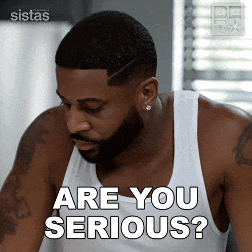 a man in a white tank top is asking if he is serious