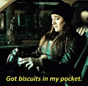 a woman sitting in a car with the words got biscuits in my pocket on the bottom