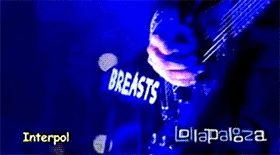a person is playing a guitar with the words bad interests on their shirt
