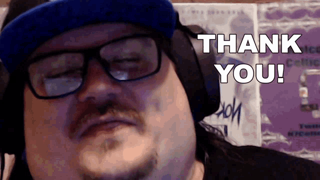 a man wearing glasses and headphones with the words thank you behind him