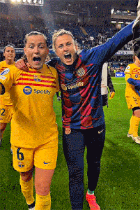 two female soccer players one wearing a spotify shirt