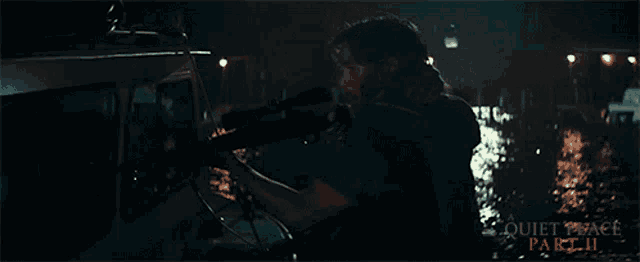 a man holding a flashlight in a quiet place part ii scene
