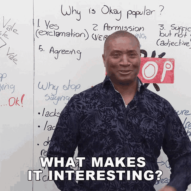 a man stands in front of a white board with the words " what makes it interesting " on it