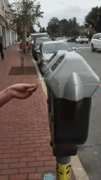 a parking meter has the number 2 on the pole