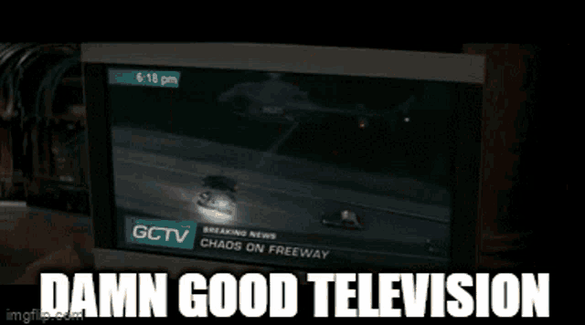 a man in a suit is adjusting his tie and says " damn good television " .