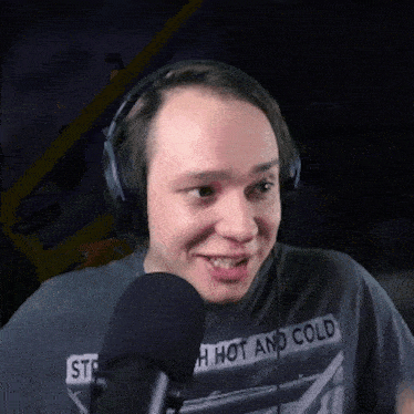 a man wearing headphones and a shirt that says " hot and cold "