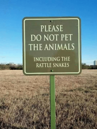 a sign that says please do not pet the animals