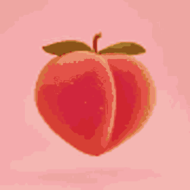 a peach with a leaf on it is on a pink background .