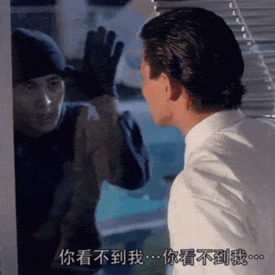 a man in a white shirt talking to another man in a black hat