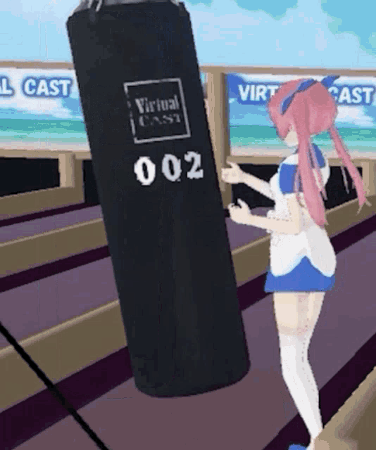 a girl with pink hair stands next to a virtual cast punching bag