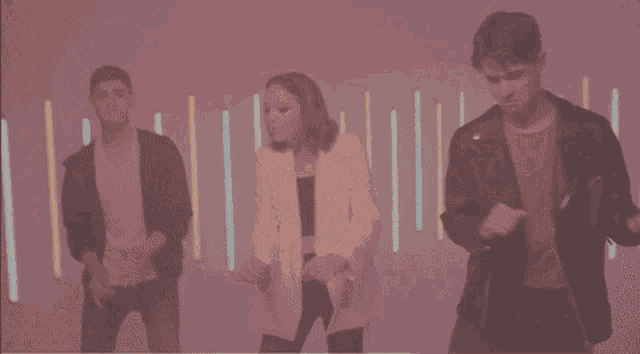 a group of young people are dancing in front of a red background