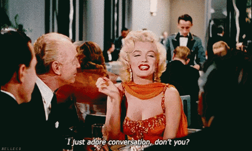 a woman in a red dress says i just adore conversation do n't you