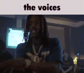 a man with dreadlocks is standing in a room with the words the voices above him