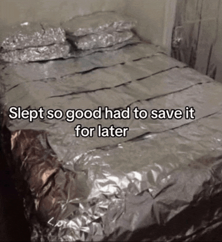 a bed that is covered in aluminum foil with the words slept so good had to save it for later