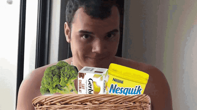 a man is holding a basket with a box of gerbi milk and a container of nesquik