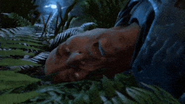 a man laying on the ground with his mouth open