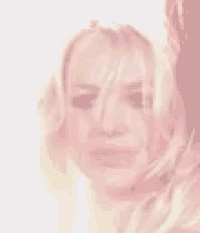 a close up of a woman 's face with a blurry background
